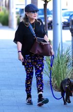 CARRIE FISHER Walks Her Dog Out in Los Angeles 09/29/2016