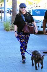 CARRIE FISHER Walks Her Dog Out in Los Angeles 09/29/2016