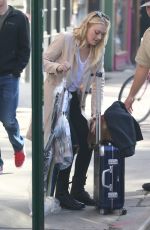 DAKOTA FANNING Leaves Her Hotel in New York 10/12/2016