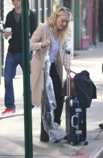 DAKOTA FANNING Leaves Her Hotel in New York 10/12/2016