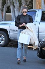 ELIZABETH OLSEN Out Shopping on Melrose Place in Los Angeles 10/28/2016