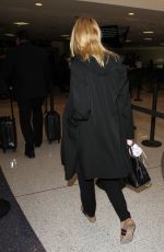ELLE FANNING at Los Angeles international Airport 10/06/2016