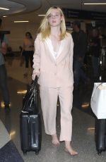 ELLE FANNING at Los Angeles International Airport 10/11/2016