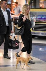 JENNIFER LAWRENCE with Her Dog at JFK Airport in New York 10/29/2016