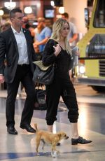 JENNIFER LAWRENCE with Her Dog at JFK Airport in New York 10/29/2016