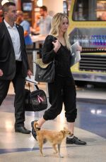 JENNIFER LAWRENCE with Her Dog at JFK Airport in New York 10/29/2016