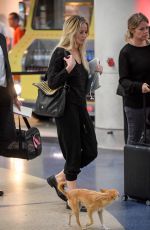 JENNIFER LAWRENCE with Her Dog at JFK Airport in New York 10/29/2016