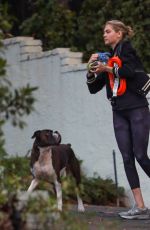 KATE UPTON Arrives at a Friend