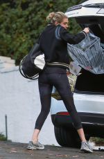 KATE UPTON Arrives at a Friend