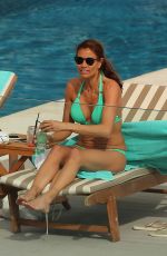 MELANIE SYKES in Bikini at a Pool in Ibiza 10/13/2016
