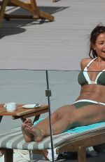 MELANIE SYKES in Bikini at Her Hotel Pool in Ibiza 10/17/2016