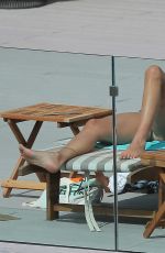 MELANIE SYKES in Bikini at Her Hotel Pool in Ibiza 10/17/2016