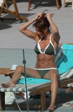 MELANIE SYKES in Bikini at Her Hotel Pool in Ibiza 10/17/2016