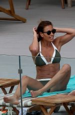 MELANIE SYKES in Bikini at Her Hotel Pool in Ibiza 10/17/2016