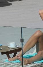 MELANIE SYKES in Bikini at Her Hotel Pool in Ibiza 10/17/2016