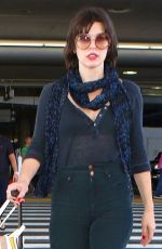 MILLA JOVOVICH at Los Angeles international Airport 10/02/2016