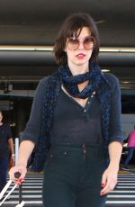 MILLA JOVOVICH at Los Angeles international Airport 10/02/2016