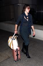 MILLA JOVOVICH at Los Angeles international Airport 10/02/2016