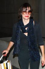 MILLA JOVOVICH at Los Angeles international Airport 10/02/2016