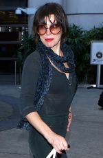 MILLA JOVOVICH at Los Angeles international Airport 10/02/2016