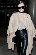 MIRANDA KERR at Los Angeles International Airport in Los Angeles 10/05/2016