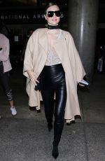 MIRANDA KERR at Los Angeles International Airport in Los Angeles 10/05/2016