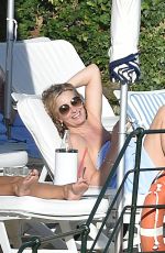 PENNY LANCASTER in Bikini at a Pool in Italy 09/19/2016