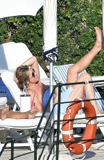 PENNY LANCASTER in Bikini at a Pool in Italy 09/19/2016