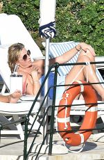 PENNY LANCASTER in Bikini at a Pool in Italy 09/19/2016