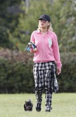 RITA ORA Walks Her Dog at a Park in London 10/01/2016