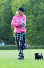 RITA ORA Walks Her Dog at a Park in London 10/01/2016