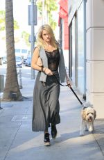 ALICE EVE Walking Her Dog Out in Beverly Hills 11/16/2016