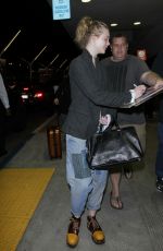 ELLE FANNING at Los Angeles International Airport 11/04/2016