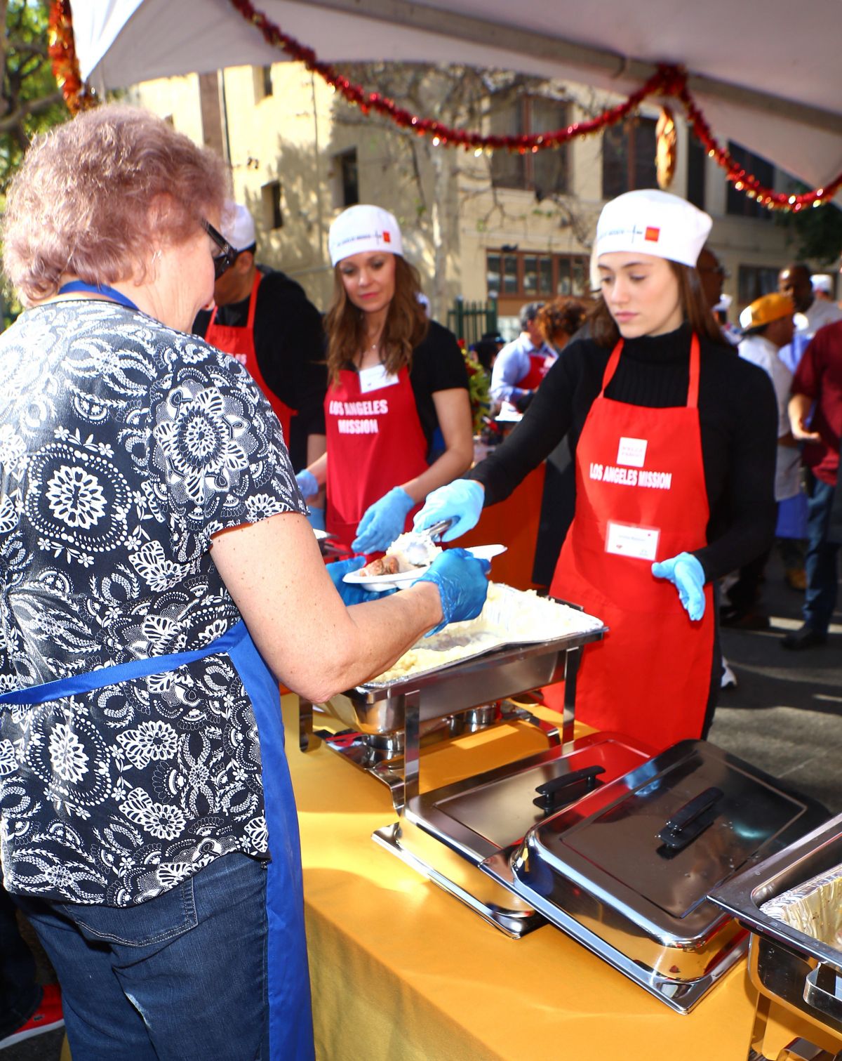 EMMY ROSSUM Volunteering at Los Angeles Mission’s Thanksgivig Meal for
