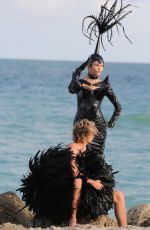 NATASHA POLY in Vinyl Outfit at a Photoshoot in Miami Beach 11/03/2016