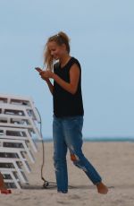 NATASHA POLY on the Set of a Photoshoot on the Beach in Miami 11/03/2016