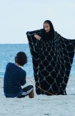 NATASHA POLY on the Set of a Photoshoota at a Beach in Miami 11/06/2016