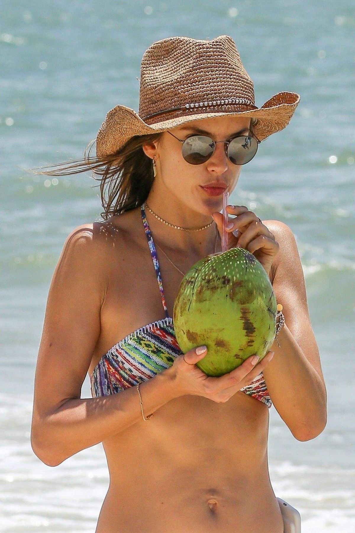 alessandra-ambrosio-in-bikini-sips-on-coconut-at-the-beach-in-florianopolis...