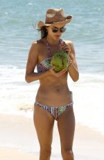 ALESSANDRA AMBROSIO in Bikini Sips on Coconut at the Beach in Florianopolis 12/20/2016