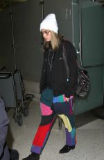CARA DELEVINGNE at LAX Airport in Los Angeles 12/12/2016