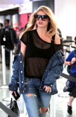 CHARLOTTE MCKINNEY in Ripped Jeans at LAX Airport 12/14/2016