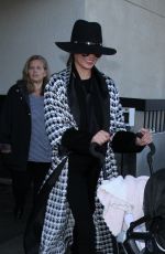 CHRISSY TEIGEN at LAX Airport in Los Angeles 12/16/2016