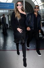 CHRISSY TEIGEN at Los Angeles International Airport 12/03/2016