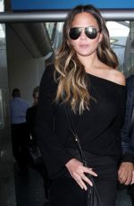 CHRISSY TEIGEN at Los Angeles International Airport 12/03/2016