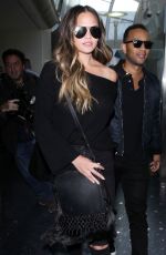 CHRISSY TEIGEN at Los Angeles International Airport 12/03/2016