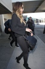 CHRISSY TEIGEN at Los Angeles International Airport 12/03/2016