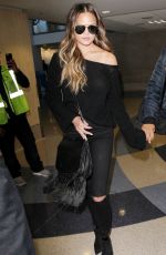 CHRISSY TEIGEN at Los Angeles International Airport 12/03/2016