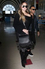 CHRISSY TEIGEN at Los Angeles International Airport 12/03/2016