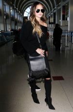CHRISSY TEIGEN at Los Angeles International Airport 12/03/2016