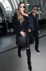 CHRISSY TEIGEN at Los Angeles International Airport 12/03/2016
